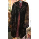 BROWN SIMULATED FUR COAT WITH RED SATIN LINING