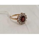 A GARNET & PASTE CLUSTER RING IN 9ct