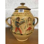 MOTTO WARE 2 HANDED LIDDED JAR DEPICTING A MUSIC BAND