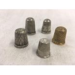 4 SILVER THIMBLES & 1 YELLOW METAL