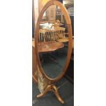 AN OVAL PINE CHEVAL MIRROR