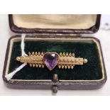 ANTIQUE BAR BROOCH SET WITH HEART SHAPED AMETHYST SET IN GOLD (BOXED)