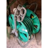 GREEN GARDEN HOSE ON REEL