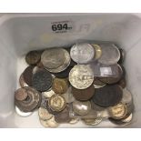 A TUB OF MOSTLY FOREIGN COINS