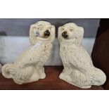 PAIR OF LARGE POTTERY SPANIELS