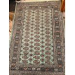 GREEN RUG AZTEC STYLE PATTERN 50'' X 74''