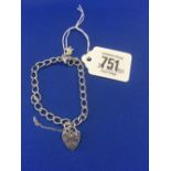 A SILVER BRACELET WITH HEART CLASP