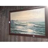 A LARGE OIL PAINTING DEPICTING SURF BREAKING ON A BEACH
