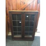 AN OAK LEADED GLASS BUREAU BOOKCASE TOP