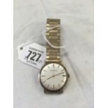 9ct CARAVELLE GENTS WATCH ON EXPANDING STRAP, ENGRAVED ON BACK, WATCH WORKING BUT A/F