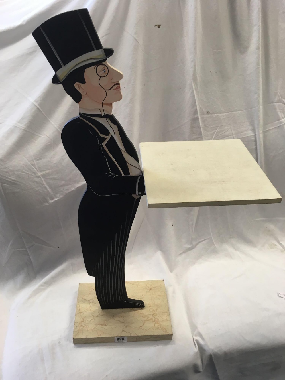 WOOD CARVING OF A BUTLER WITH TRAY