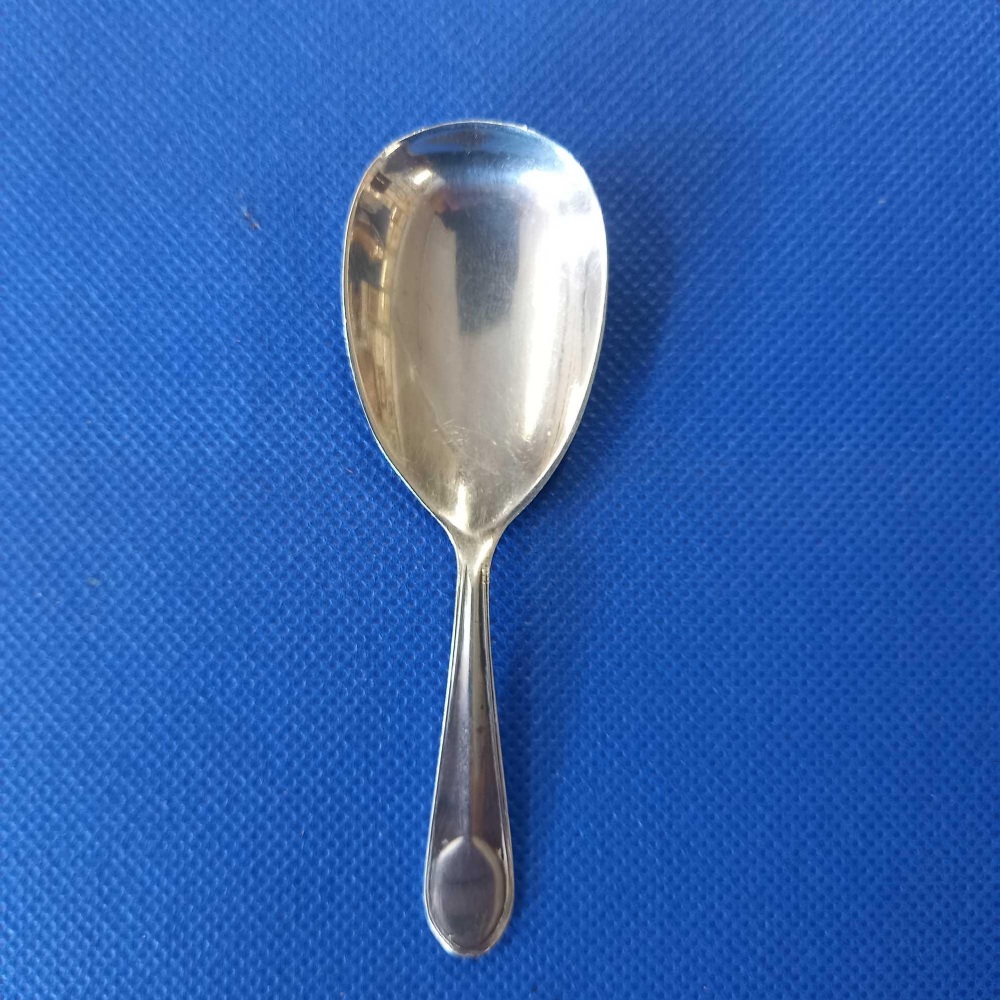 A SILVER CADDY SPOON SHEFFIELD 1928 BY C.B & S