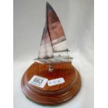 WHITE METAL SAIL YACHT ON WOOD PLINTH, MARKED RCNV TENIS