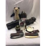 CARTON WITH BELLOWS CAMERA, CLOCK WORK ENGINE, HIP FLASK & RAZORS