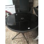 BLACK GLASS TOP ROUND PATIO TABLE WITH PROVISION FOR PARASOL & 4 CHAIRS