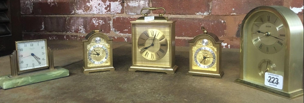 4 CARRAIGE CLOCK STYLE TABLE CLOCKS & 1 OTHER - NOT KNOW IF WORKING