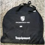 A PAIR OF PORSCHE SNOW CHAINS IN CANVAS CARRY CASE, (ZIP NEEDS REPLACING ON BAG)