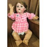 A DOLL WITH A BISQUE HEAD & MAKERS MARKS ON NECK A/F
