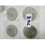 FOUR CHINESE SILVER COLOURED COINS