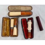 QTY OF CASED SILVER MOUNTED MEERSCHAUM & AMBER CHEROOT HOLDERS