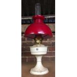 CREAM PAINTED PARAFFIN VALOR LAMP WITH RED SHADE & CLEAR GLASS CHIMNEY
