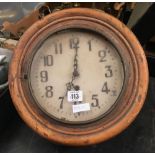 AN OLD WOOD WORMED WALL CLOCK