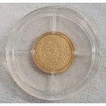 A SMALL 14ct GOLD REPLICA COIN WITH PAPERWORK