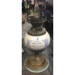 VINTAGE OIL LAMP CONVERTED TO ELECTRICITY WITH CHINA RESERVOIR WITH NAME DEMIJOHNS CHOICE LIQUORS
