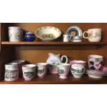 2 SHELVES OF SOUVENIR CUPS, SAUCERS & BEATRIX POTTER CHINA ETC