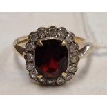 AN OVAL CLUSTER DRESS RING SET IN 9ct