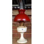 CREAM PAINTED PARAFFIN VALOR LAMP WITH RED SHADE & CLEAR GLASS CHIMNEY