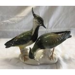 A PAIR OF KARL ENS CHINA LAP WINGS, HEAD FEATHERS ON ONE RE-GLUED