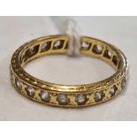 AN 18ct GOLD MOUNTED ETERNITY RING