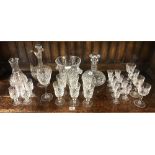 SHELF OF CUT GLASS WINE GLASSES, SHERRY GLASSES ETC, ICE BUCKET, DECANTER, CLARET JUG & WATER