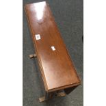 MAHOGANY SUTHERLAND TABLE WITH TURNED LEGS ON CASTERS