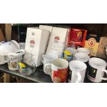 SHELF OF VARIOUS COFFEE, TEA MUGS, TETLEY TEA POT CLOCK, STONEWARE MUGS, COCA-COLA GLASSES, STELLA