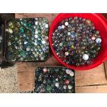 A TUB & TWO TINS OF MARBLES