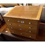 LIGHT OAK CHEST OF 4 DRAWERS (LABELED A, B, C, D) 18'' X 14'' (LABEL ON BACK BAYKO SPARE PARTS)