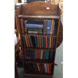 NARROW OAK BOOKCASE WITH 5 SHELVES, 1ft 10'' WIDE & 4 SHELVES OF HARDBACK BOOKS