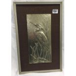 A HAND BEATEN PEWTER PANEL OF A HERON. BY BETTY HARPER
