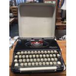 PORTABLE OLYMPIA TYPEWRITER IN CASE