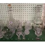 SHELF OF CUT GLASS DECANTERS, GLASSES, VASES ETC