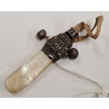 A VICTORIAN SILVER MOUNTED CHILD'S WHISTLE WITH M.O.P END, B'HAM 1893