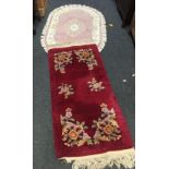 HAND MADE INDIAN WOOLEN OVAL RUG WITH TASSELED EDGE & RED GROUND FLORAL RECTANGULAR RUG