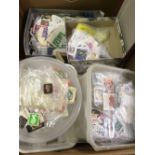 LARGE CARTON OF WORLD POSTAGE STAMPS, LOOSE IN TUBS, BOXES & PLASTIC BAGS