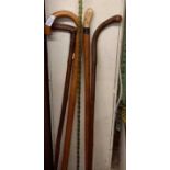 LONG TWISTED GLASS WALKING STICK & 4 OTHER WOODEN WALKING STICKS, 1 WITH BONE HANDLE