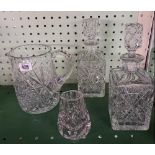 SHELF OF CRYSTAL GLASSWARE WITH PAIR OF DECANTERS & 1 OTHER, WATER JUG, FRUIT BOWL ETC