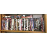 SHELF OF MIXED DVD'S OF VARIOUS SUBJECTS