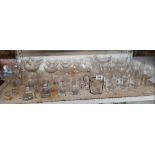 SHELF OF VARIOUS DRINKING GLASSES