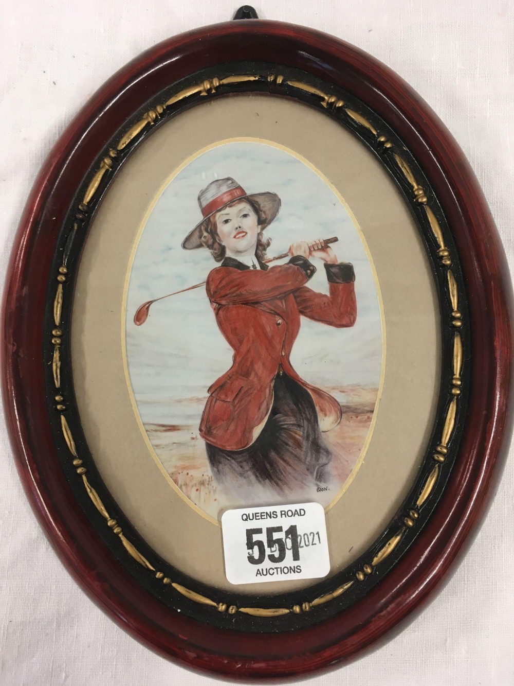 OVAL PORTRAIT MINIATURE OF A LADY GOLFER, INDISTINCTLY SIGNED